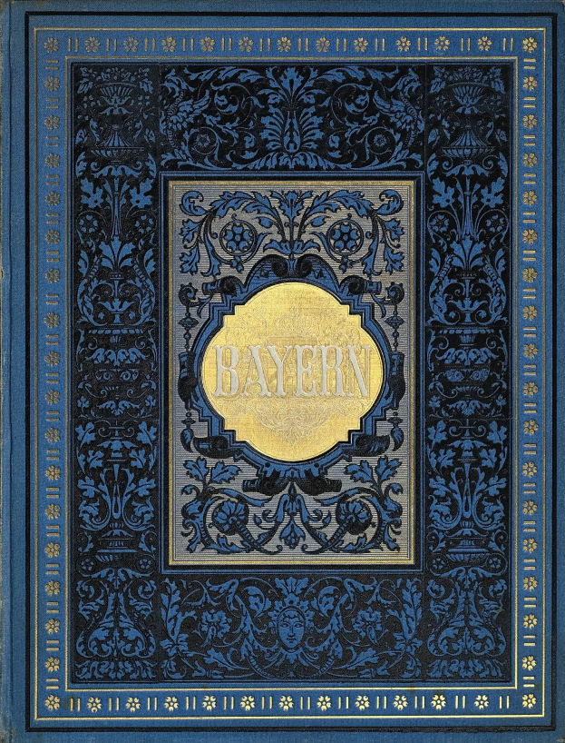 Ein blau-goldenes Buch mit dem Wort "Bayern" auf dem Cover, das mit detailreichen Verzierungen versehen ist.