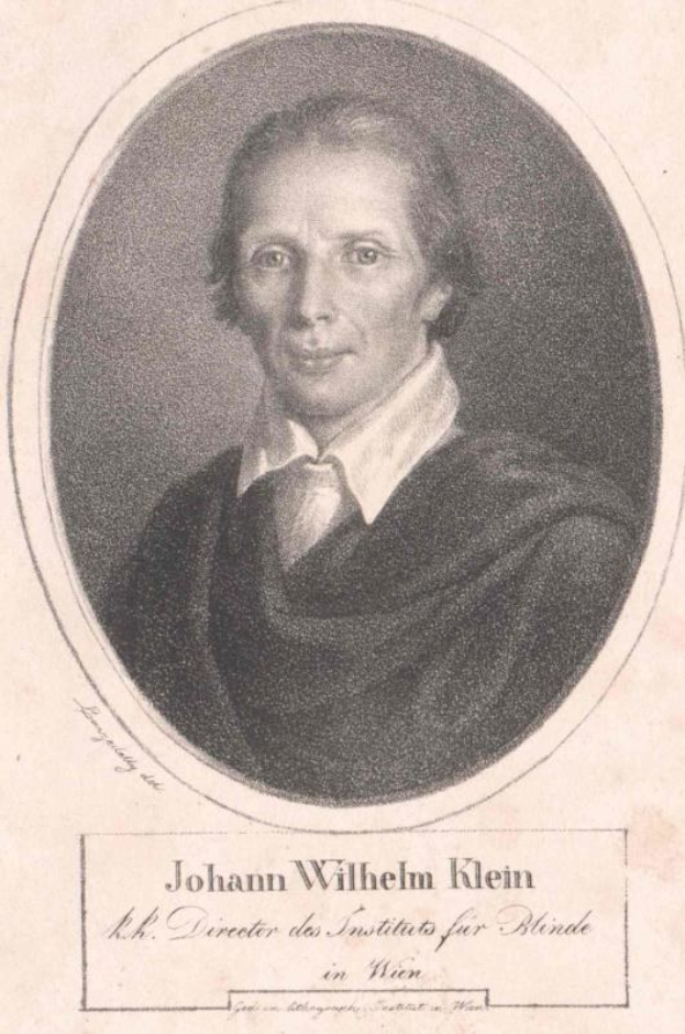 Schwarzes und weißes Porträt von Johann Wilhelm Klein, Direktor des Instituts für Blinde in Wien, der einen weißen Hemd mit ernstem Gesichtsausdruck trägt, mit deutschem Text unten.